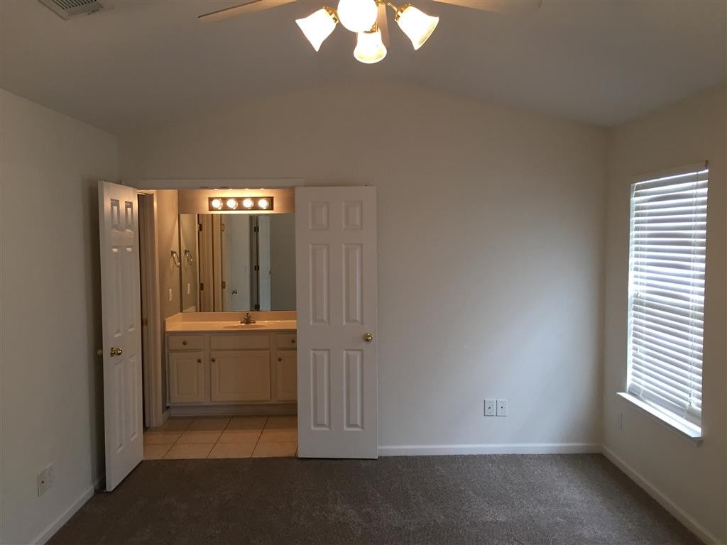 1101 Downs Boulevard, Unit 125 Franklin, TN 37064 - Photo 6 of 8 wooden floor and window in an empty room