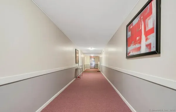 a view of a hallway with stairs