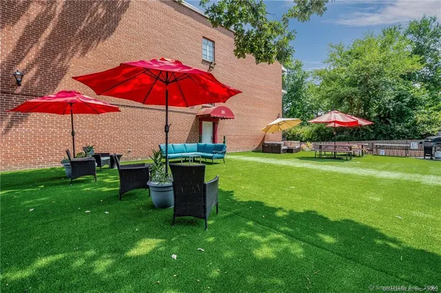 a view of yard with an outdoor seating
