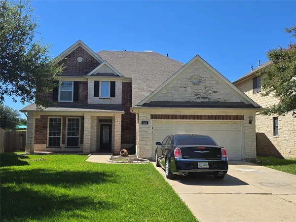 a car parked in front of a house