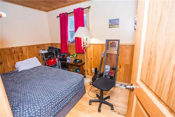 a bed room with a bed and a desk