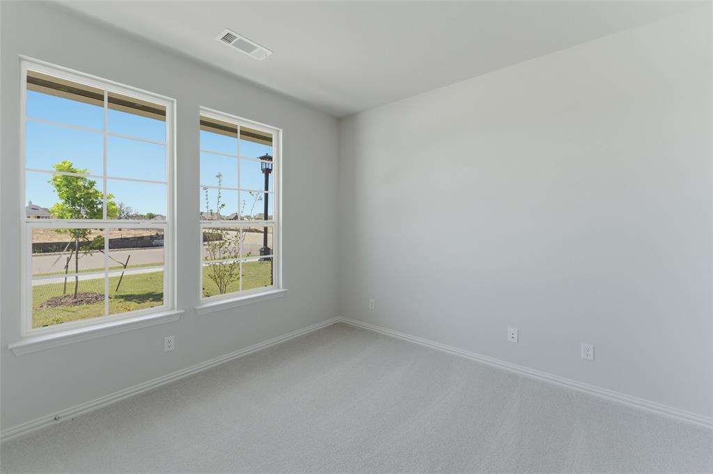 1221 Sabine River Lane Springtown, TX 76082 - Photo 6 of 25 Unfurnished room featuring light colored carpet and baseboards