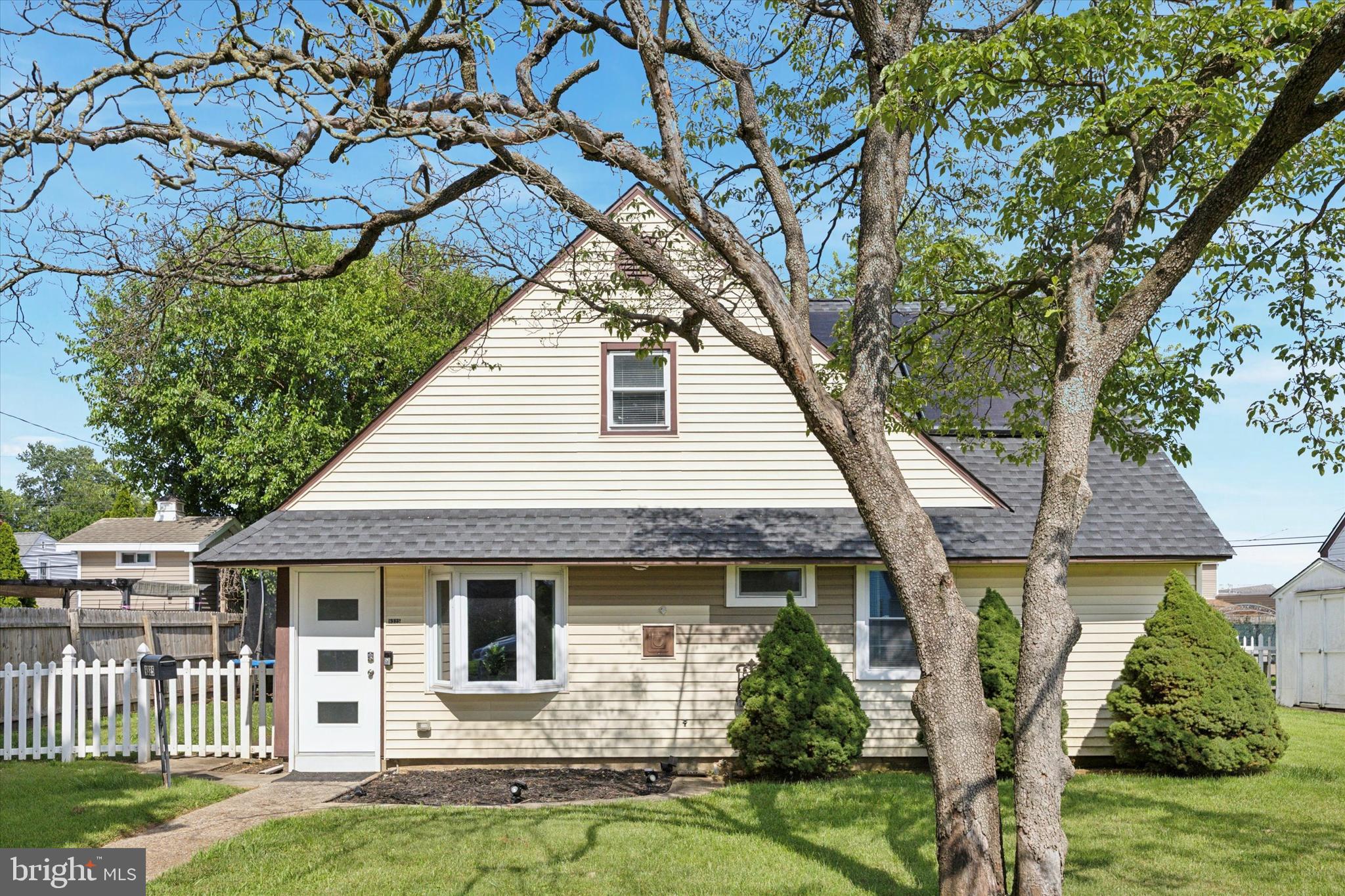 9325 Andover Road Philadelphia, PA 19114 - Photo 3 of 3 a front view of a house with garden