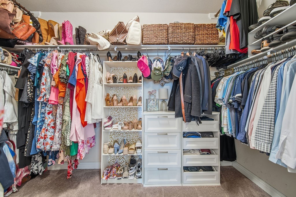 9614 Carson Lane Iowa Colony, TX 77583 - Photo 26 of 50 *Primary walk-in closet* There is more to this closet than this picture shows. Come see it for yourself.