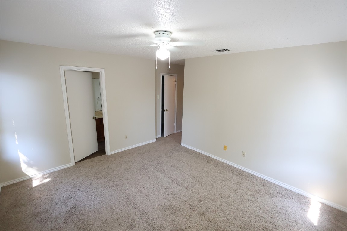 6714 Windrift Way Austin, TX 78745 - Photo 13 of 20 a view of an empty room with a ceiling fan