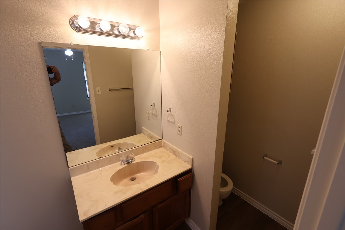 6714 Windrift Way Austin, TX 78745 - Photo 14 of 20 a bathroom with a sink and a mirror