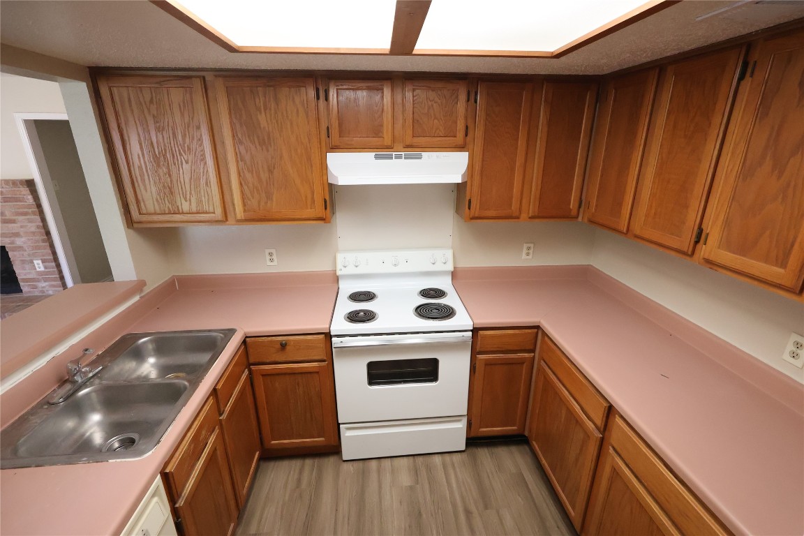 6714 Windrift Way Austin, TX 78745 - Photo 7 of 20 a view of a kitchen with a stove top oven