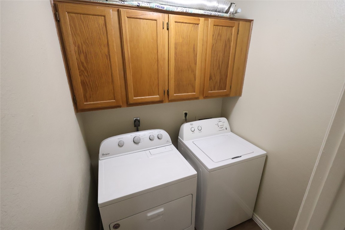 6714 Windrift Way Austin, TX 78745 - Photo 8 of 20 a utility room with dryer and washer