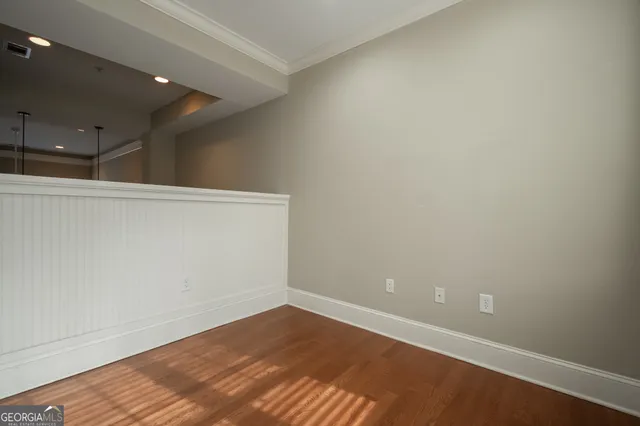 a view of entryway with stairs and wooden floor
