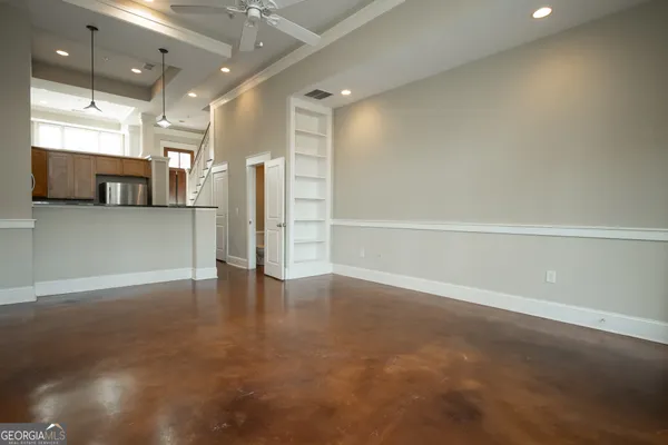 a view of a kitchen with a refrigerator and a sink