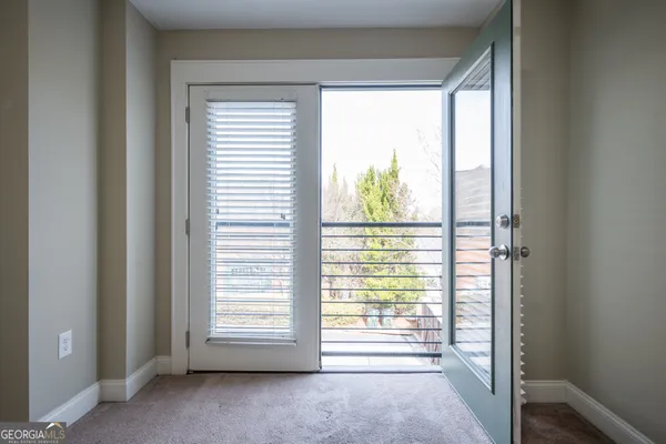 a view of an empty room and a window
