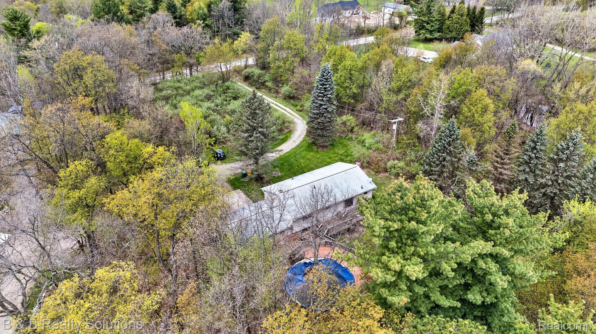 2467 North Lake George Road Metamora, MI 48455 - Photo 41 of 46 Drone / aerial view of a tree filled landscape