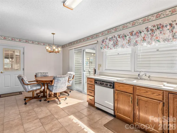 a kitchen with stainless steel appliances granite countertop a sink and a granite counter tops