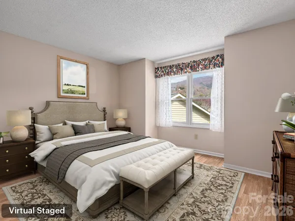 a bedroom with bed and a window