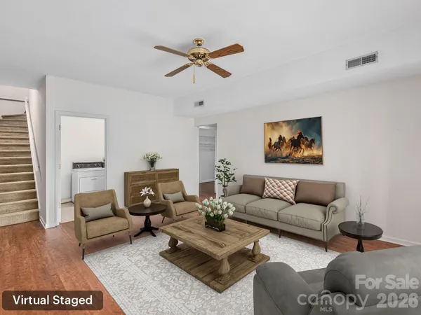 a living room with furniture and a rug