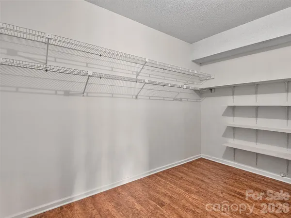 a view of a room with shelf on the wall