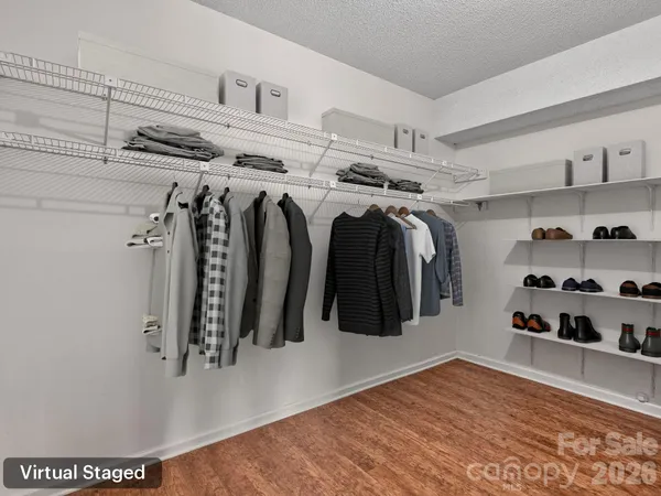 a view of a closet with storage and utility