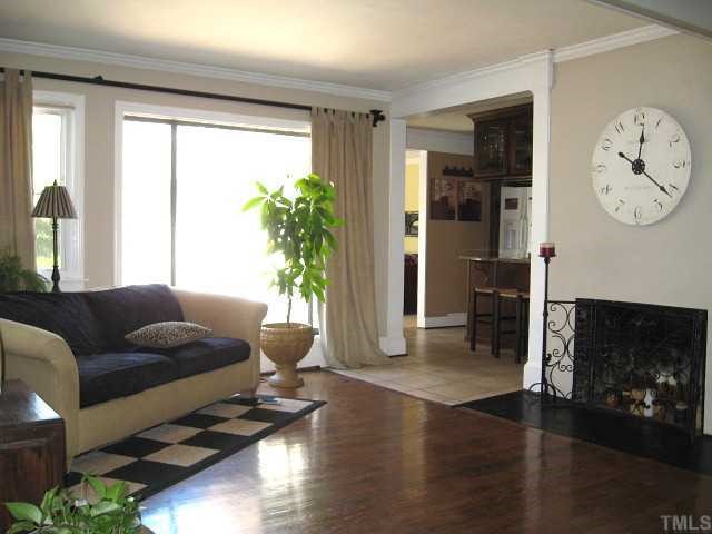 823 Graham Street Raleigh, NC 27605 - Photo 3 of 12 a living room with furniture and a large window