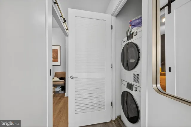a view of a hallway with washer and dryer