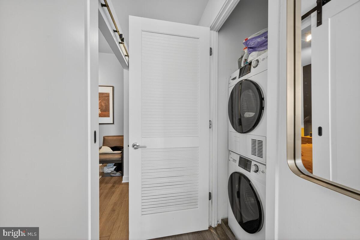 2030 8th Street Northwest, Unit 507 Washington, DC 20001 - Photo 14 of 23 a view of a hallway with washer and dryer