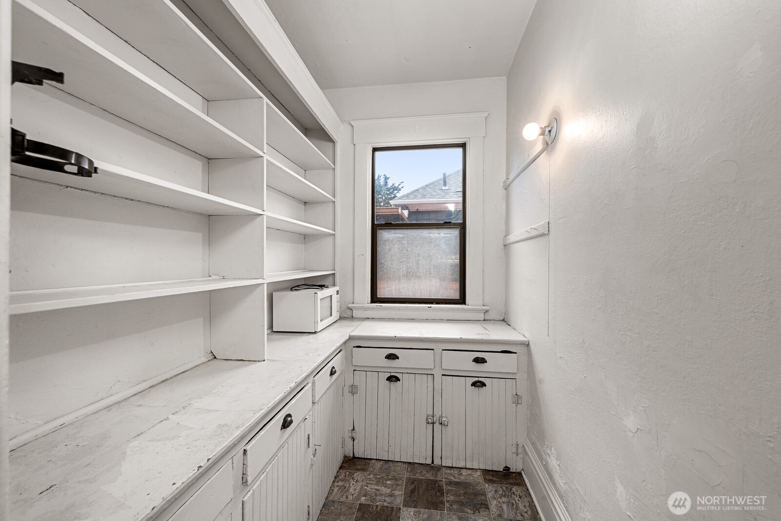 6636 Carleton Avenue South Seattle, WA 98108 - Photo 11 of 30 a kitchen with a cabinets and window