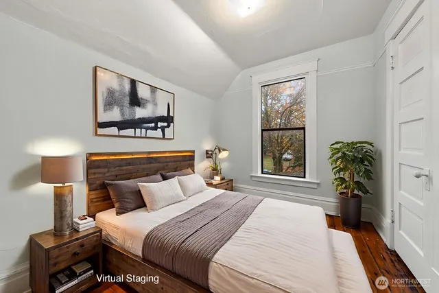 a bedroom with bed and a window