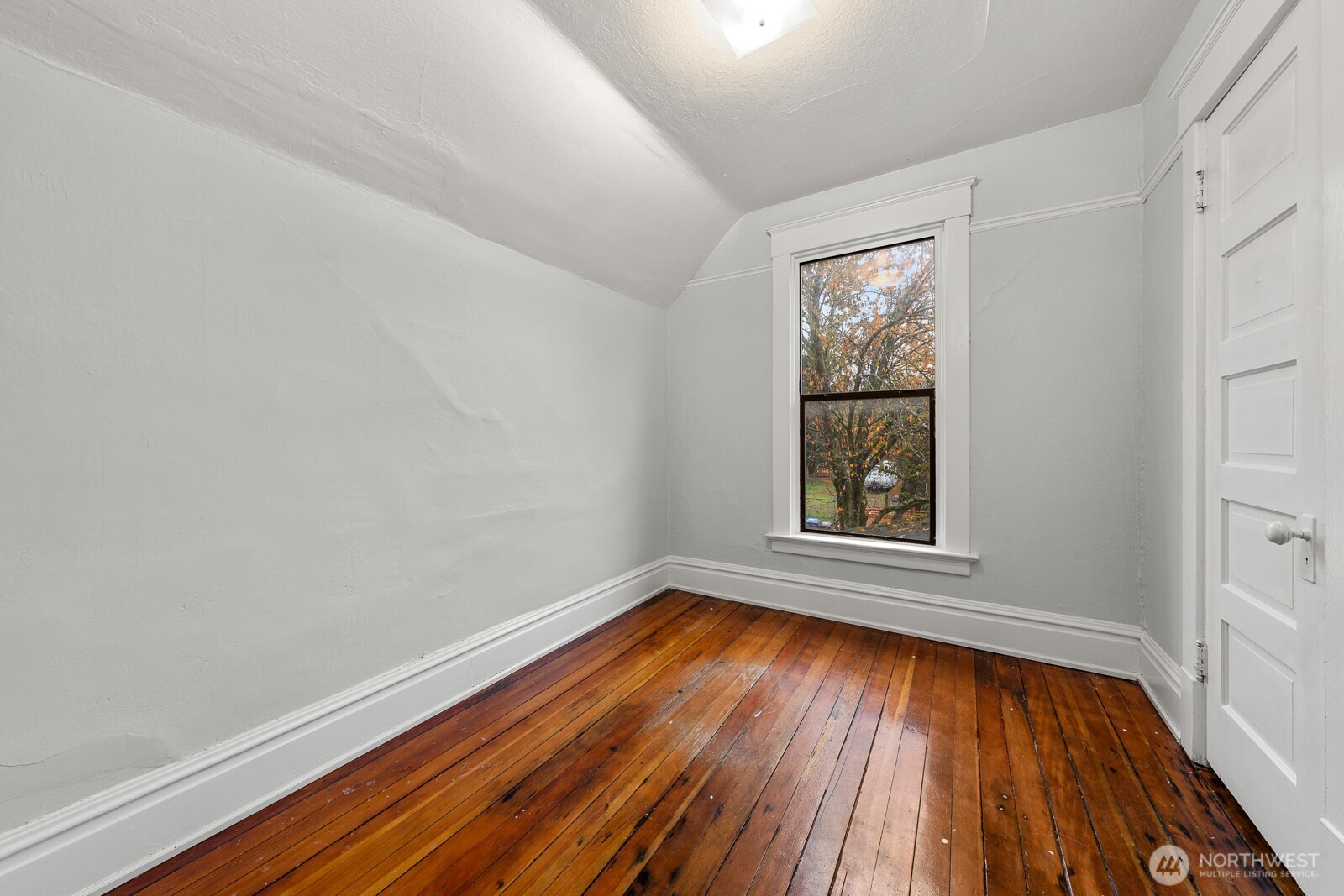 6636 Carleton Avenue South Seattle, WA 98108 - Photo 14 of 30 a view of an empty room with wooden floor and a window
