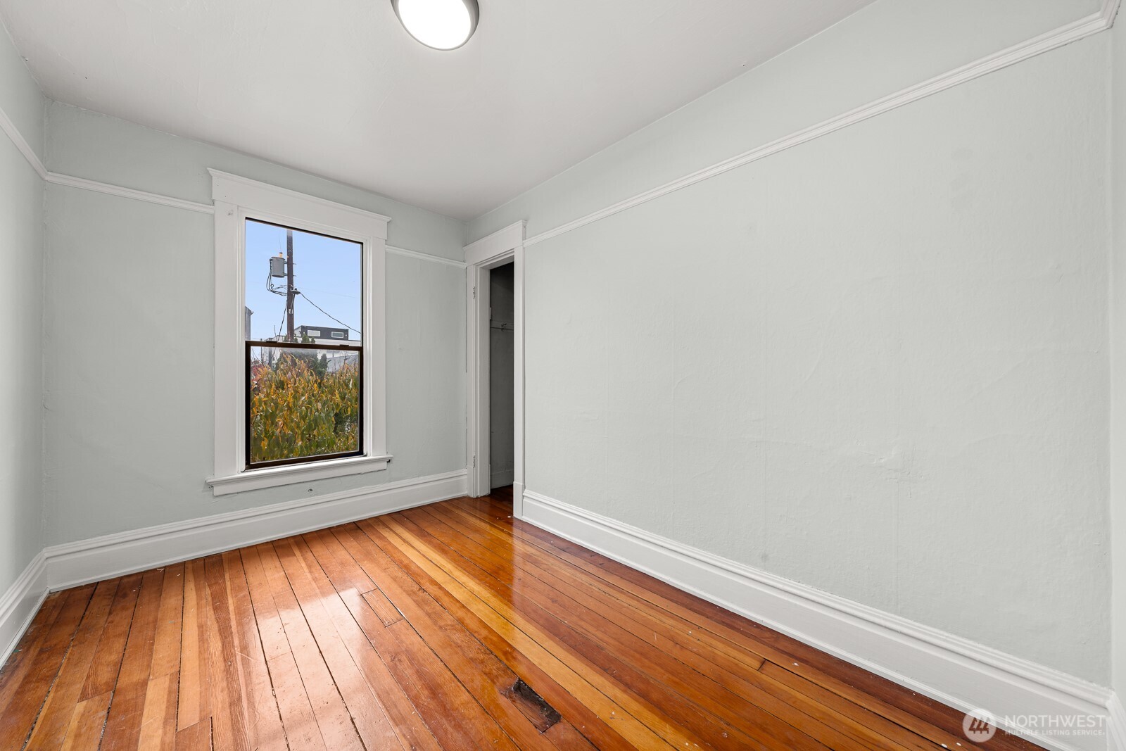 6636 Carleton Avenue South Seattle, WA 98108 - Photo 15 of 30 an empty room with wooden floor and windows