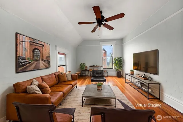 a living room with furniture and a flat screen tv