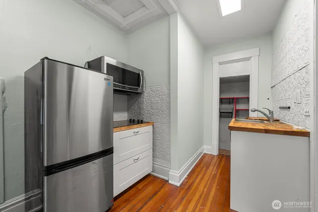 a kitchen with stainless steel appliances a refrigerator and a sink