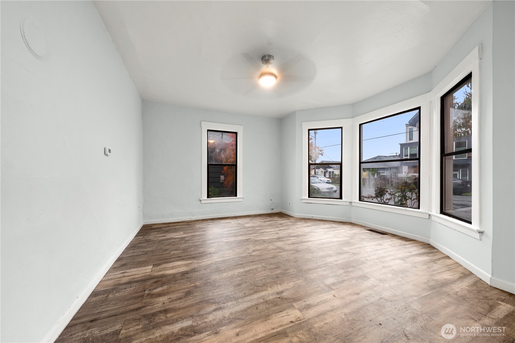 6636 Carleton Avenue South Seattle, WA 98108 - Photo 3 of 30 a view of an empty room with window and wooden floor