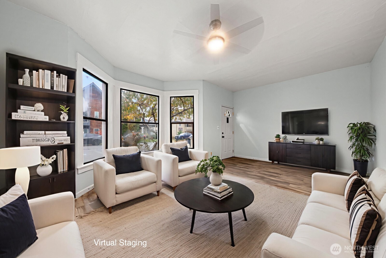 6636 Carleton Avenue South Seattle, WA 98108 - Photo 4 of 30 a living room with furniture and a flat screen tv