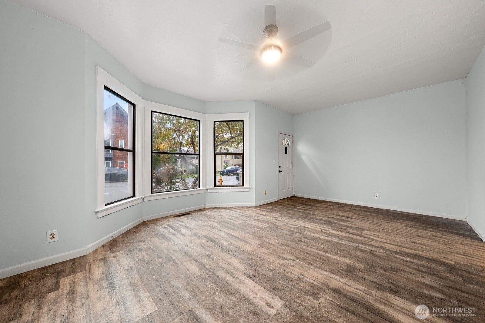 6636 Carleton Avenue South Seattle, WA 98108 - Photo 5 of 30 a view of an empty room with a window and wooden floor