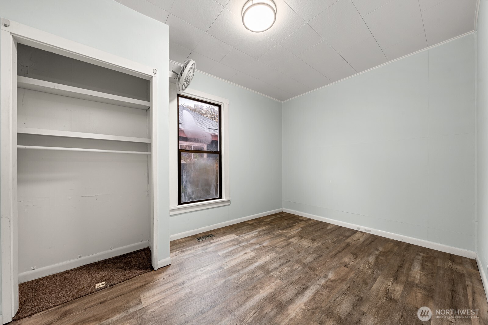 6636 Carleton Avenue South Seattle, WA 98108 - Photo 8 of 30 a view of an empty room with wooden floor and closet
