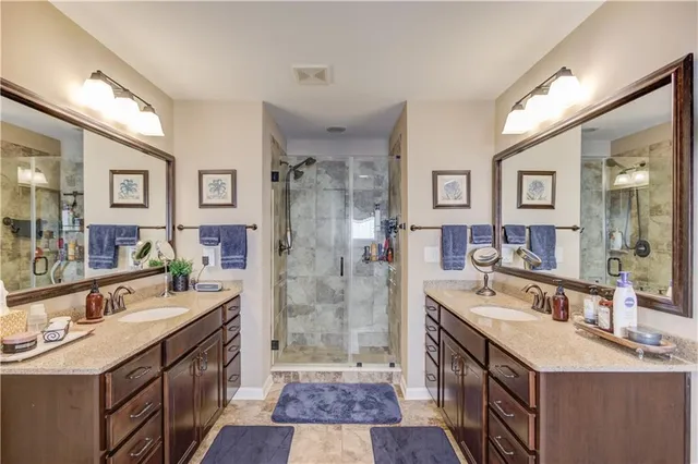 a bathroom with a tub and a mirror