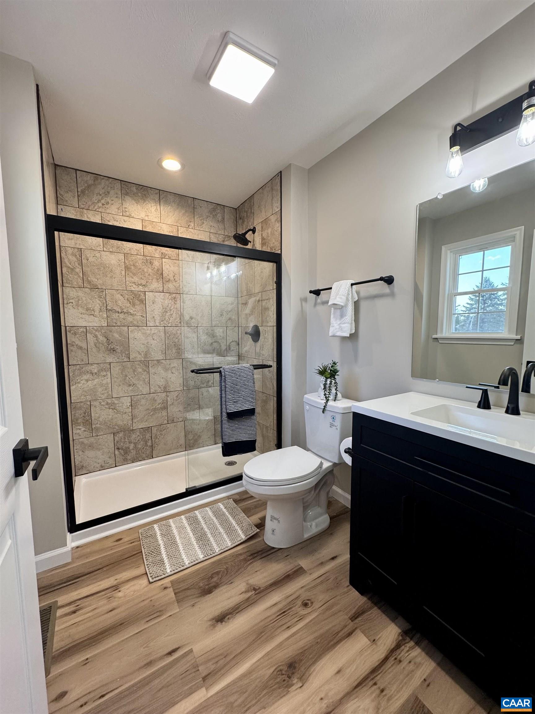 200 Robinhood Road Staunton, VA 24401 - Photo 19 of 75 a bathroom with a sink toilet a mirror and shower