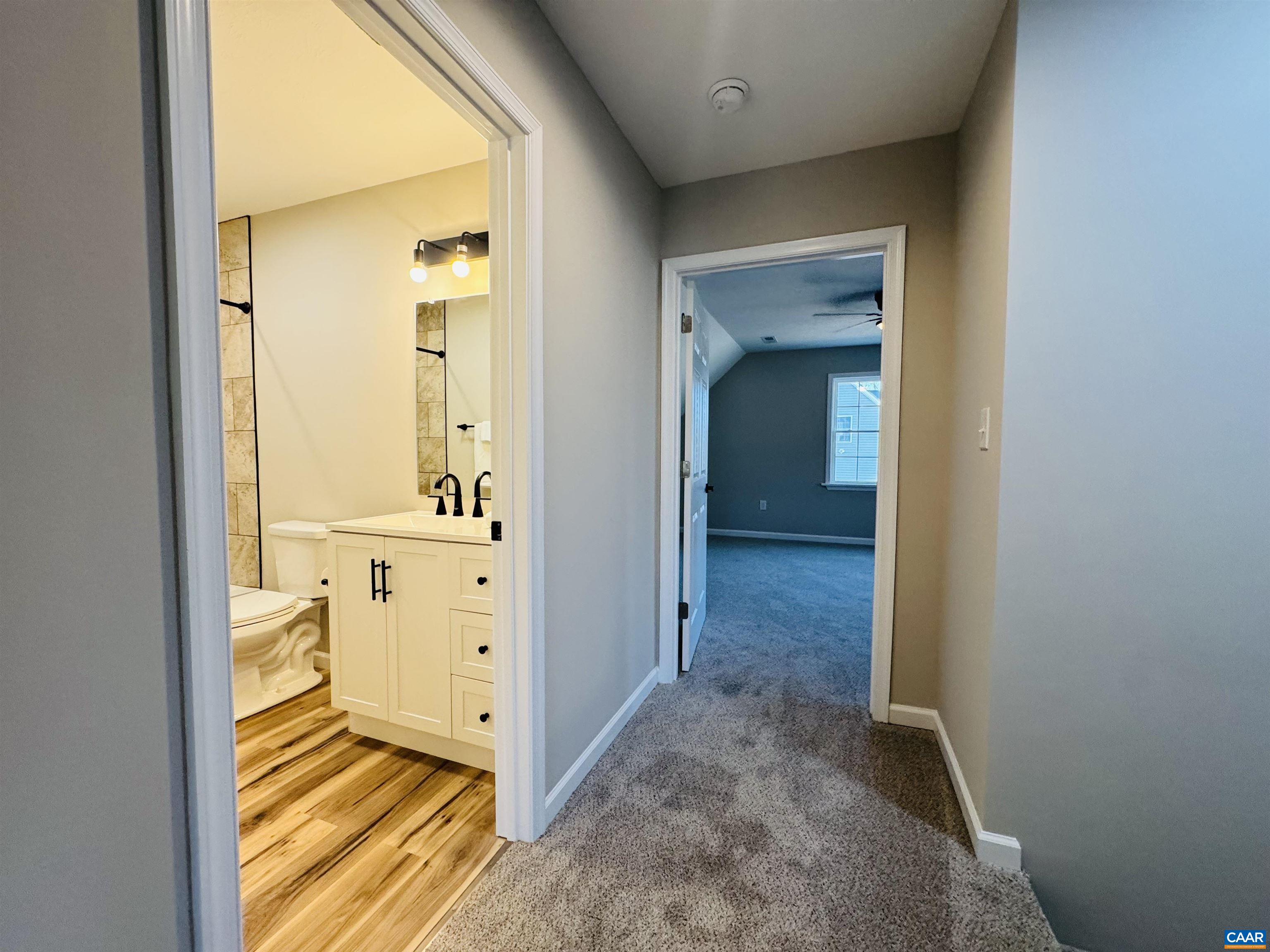 200 Robinhood Road Staunton, VA 24401 - Photo 38 of 75 a view of a hallway with wooden floor and a bathroom