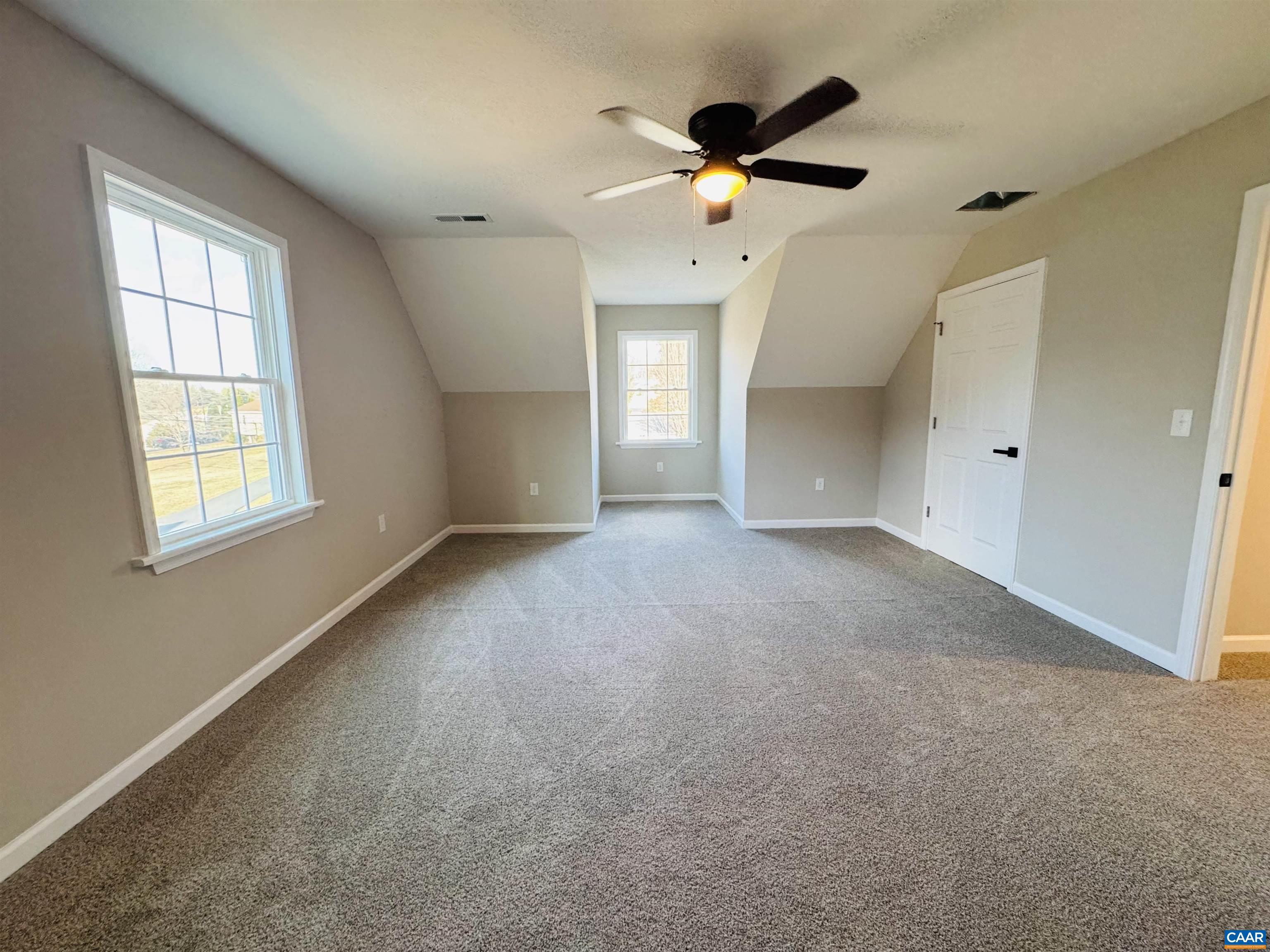 200 Robinhood Road Staunton, VA 24401 - Photo 46 of 75 an empty room with a chandelier fan and windows