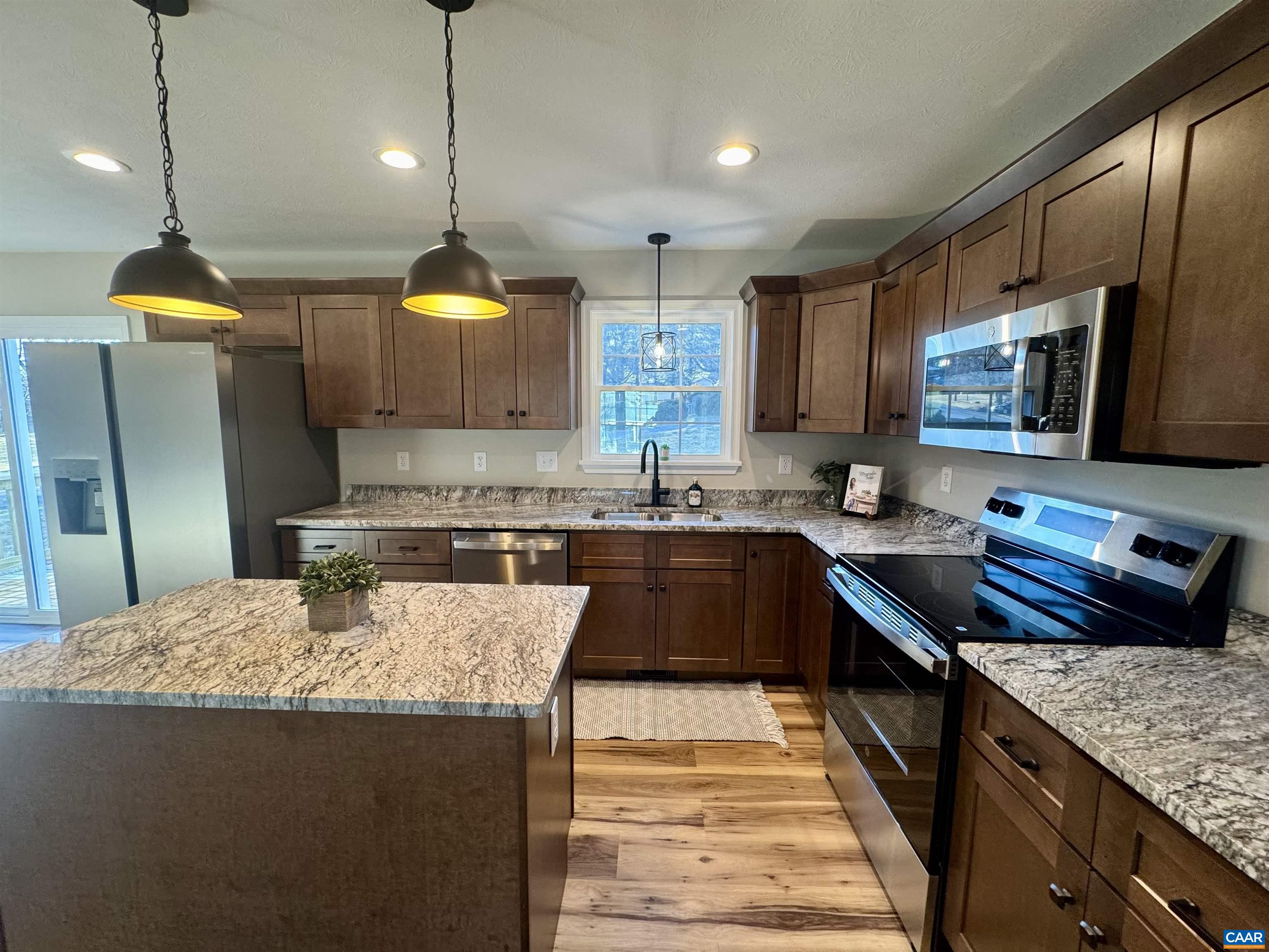 200 Robinhood Road Staunton, VA 24401 - Photo 9 of 75 a kitchen with stainless steel appliances granite countertop a sink a stove and a wooden floors