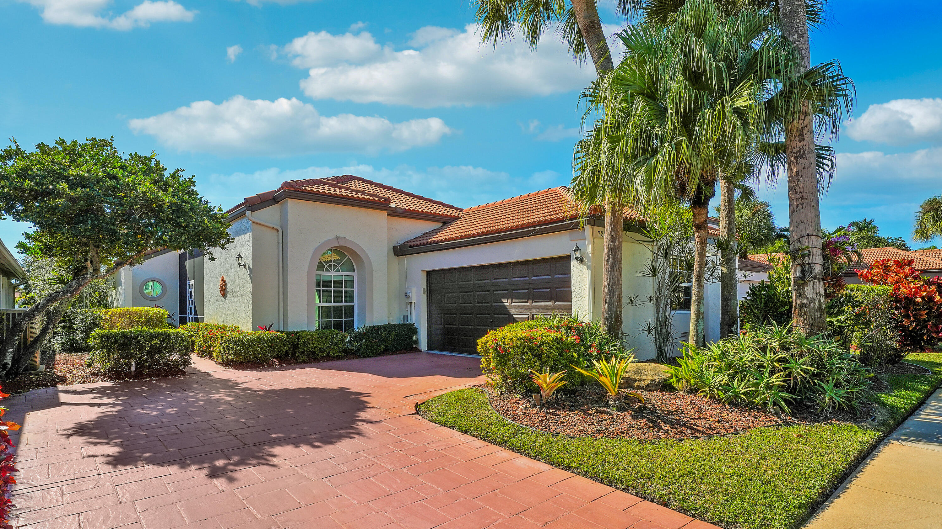 7283 Via Palomar Boca Raton, FL 33433 - Photo 1 of 43 a front view of a house with garden