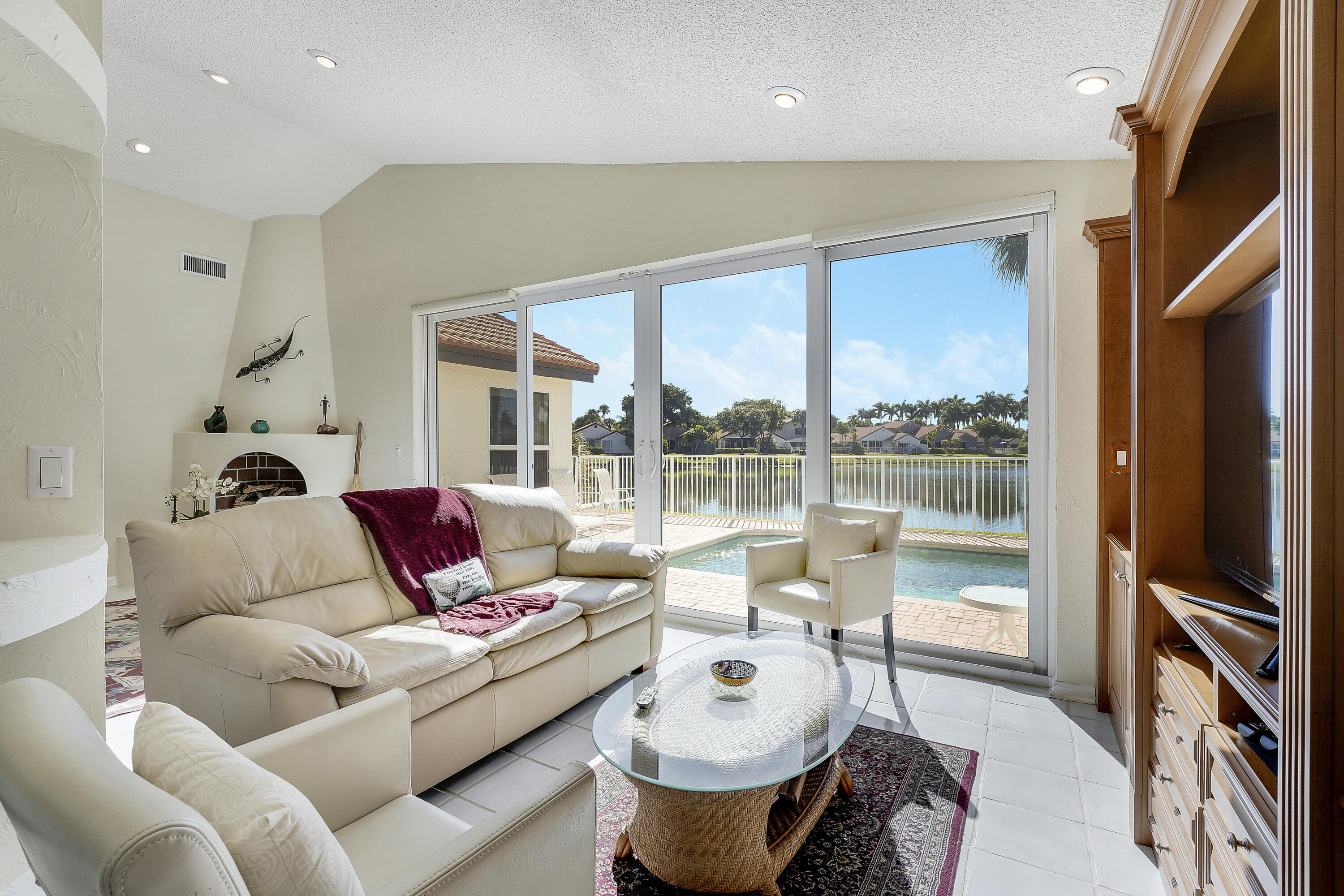 7283 Via Palomar Boca Raton, FL 33433 - Photo 14 of 43 a living room with furniture a large window and a flat tv screen