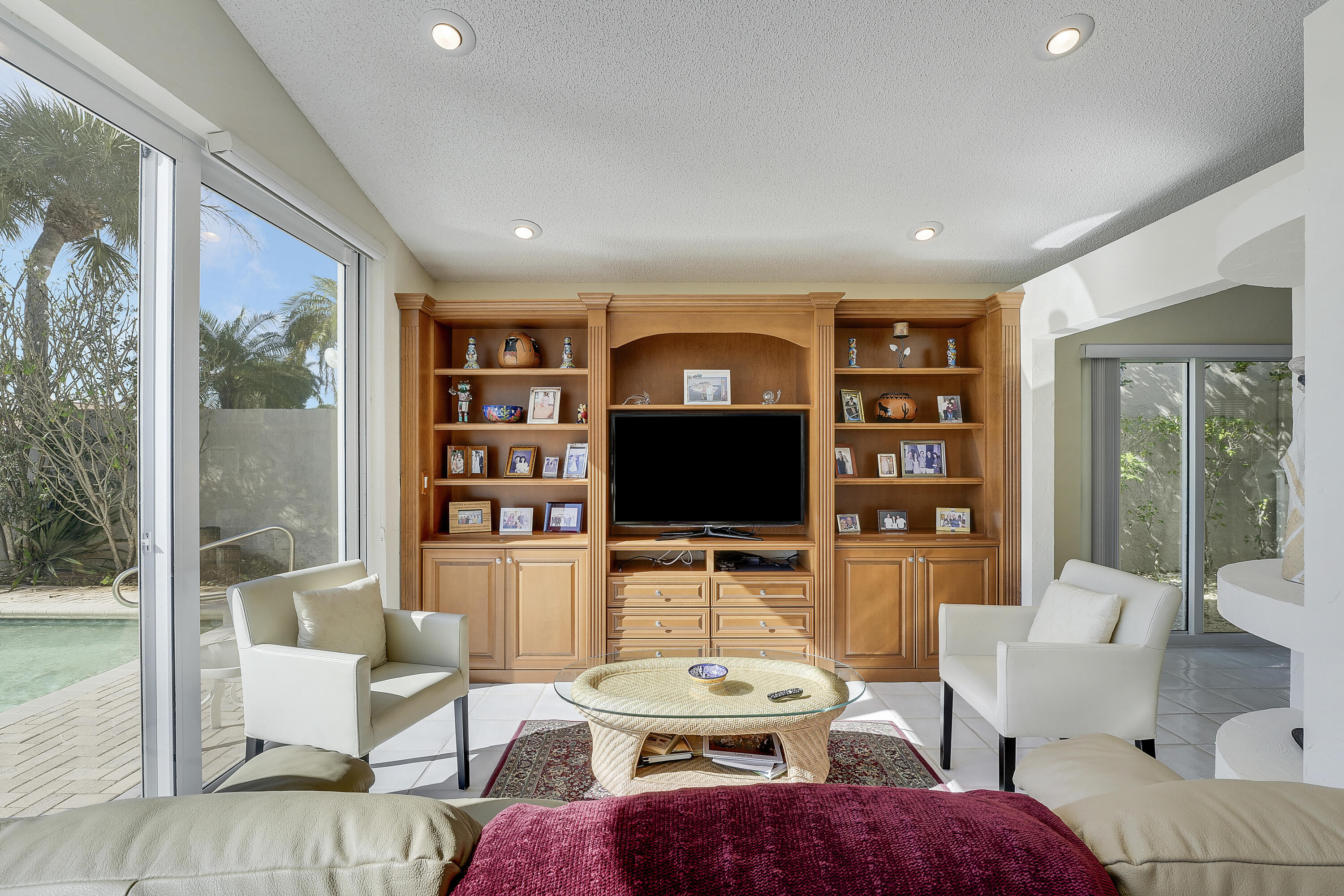 7283 Via Palomar Boca Raton, FL 33433 - Photo 15 of 43 a living room with furniture a flat screen tv and a floor to ceiling window