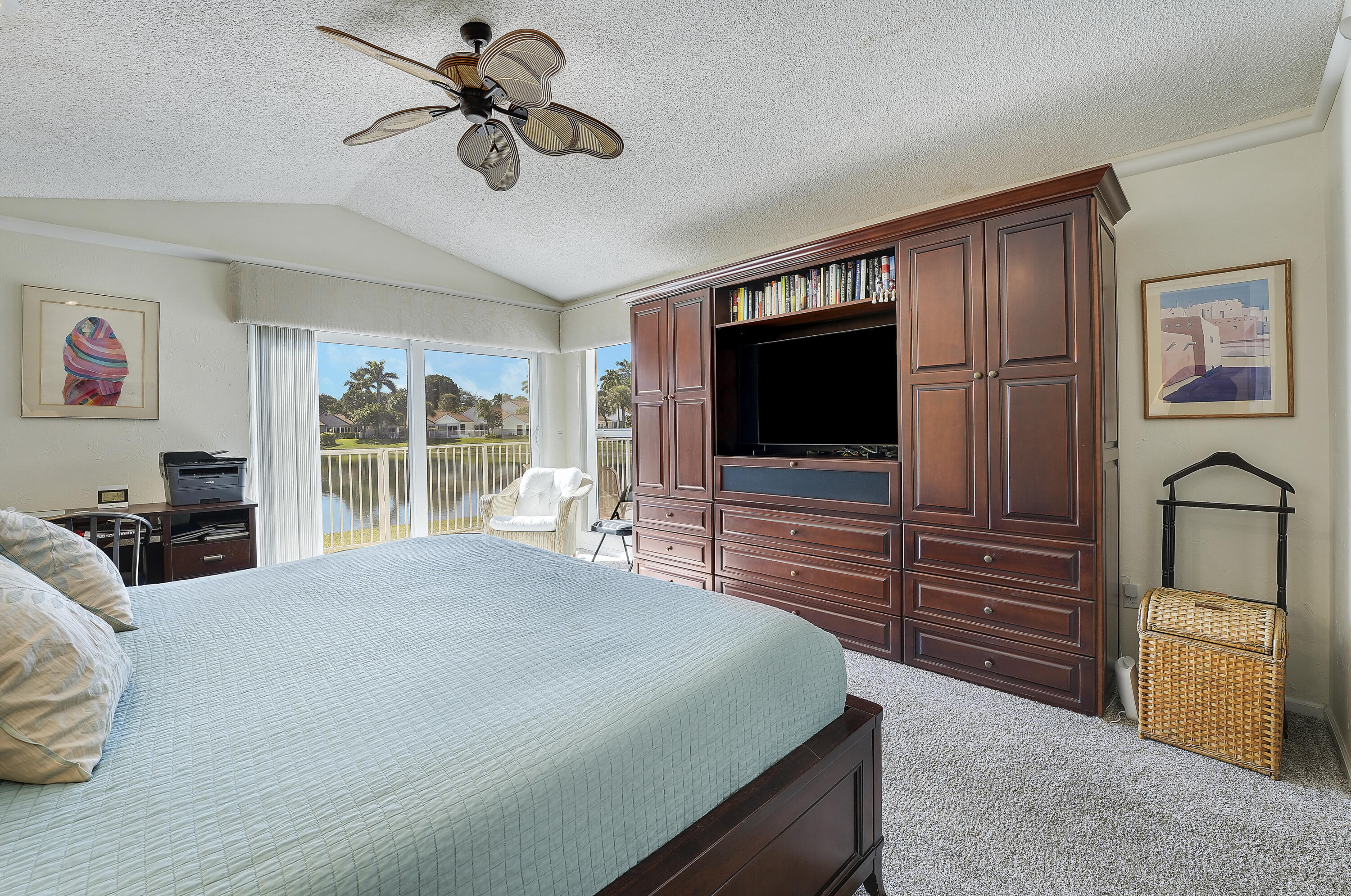 7283 Via Palomar Boca Raton, FL 33433 - Photo 23 of 43 a bedroom with a bed and a flat screen tv