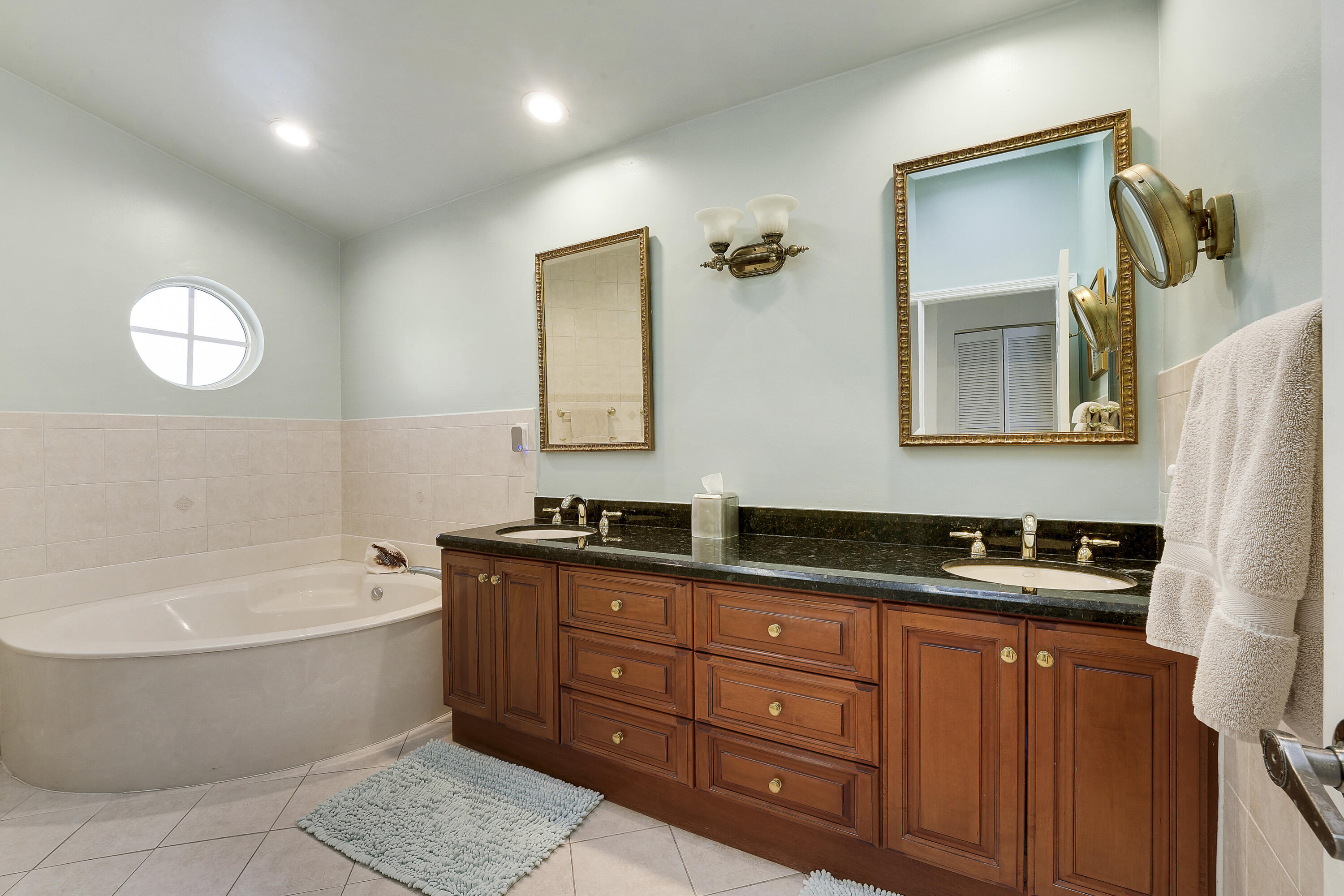 7283 Via Palomar Boca Raton, FL 33433 - Photo 25 of 43 a bathroom with a tub sink and mirror