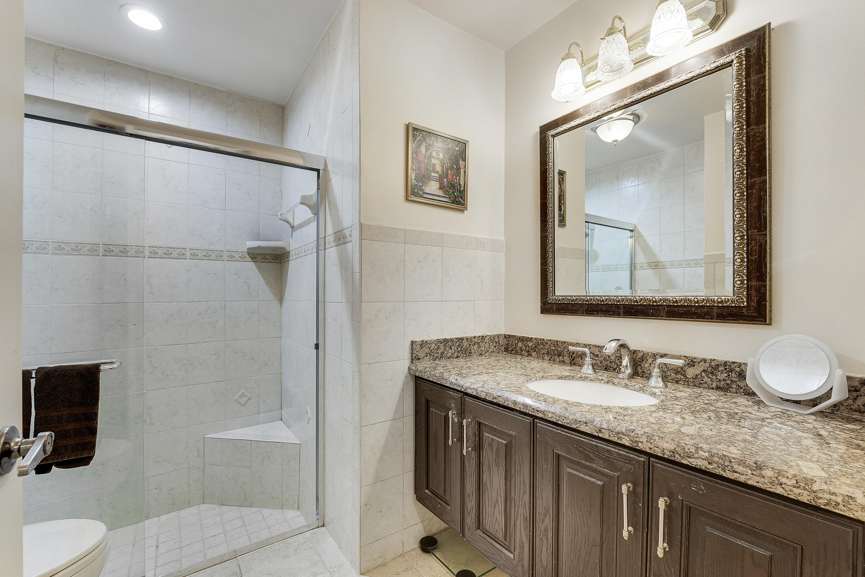 7283 Via Palomar Boca Raton, FL 33433 - Photo 30 of 43 a bathroom with a granite countertop sink mirror vanity and toilet