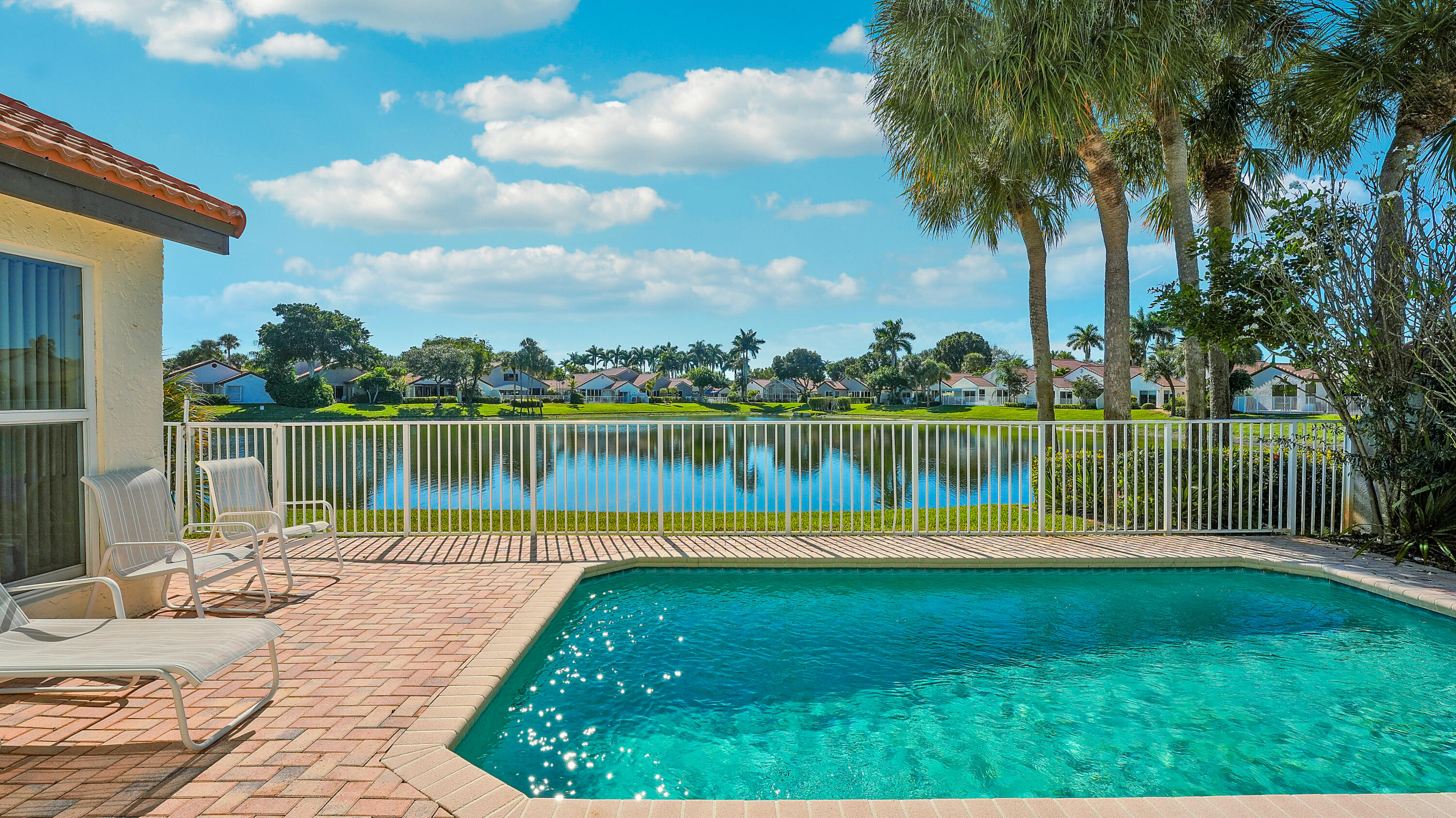 7283 Via Palomar Boca Raton, FL 33433 - Photo 33 of 43 a view of a lake with a house in the background