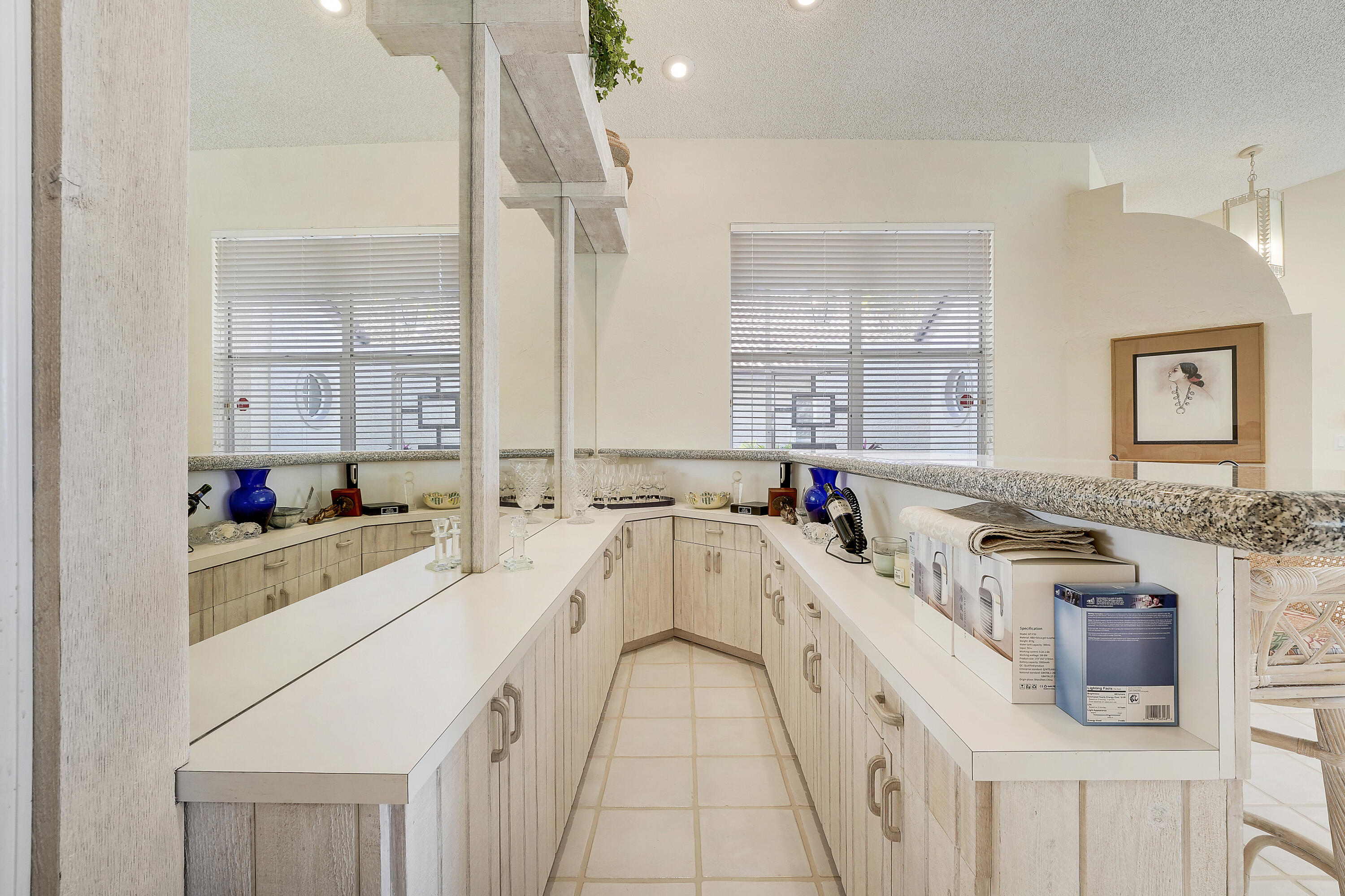7283 Via Palomar Boca Raton, FL 33433 - Photo 10 of 43 a large white kitchen with stainless steel appliances a sink stove and cabinets