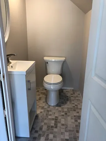 a bathroom with a toilet and a sink