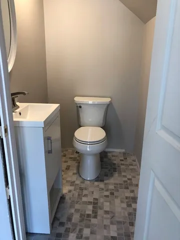 a bathroom with a toilet and a sink
