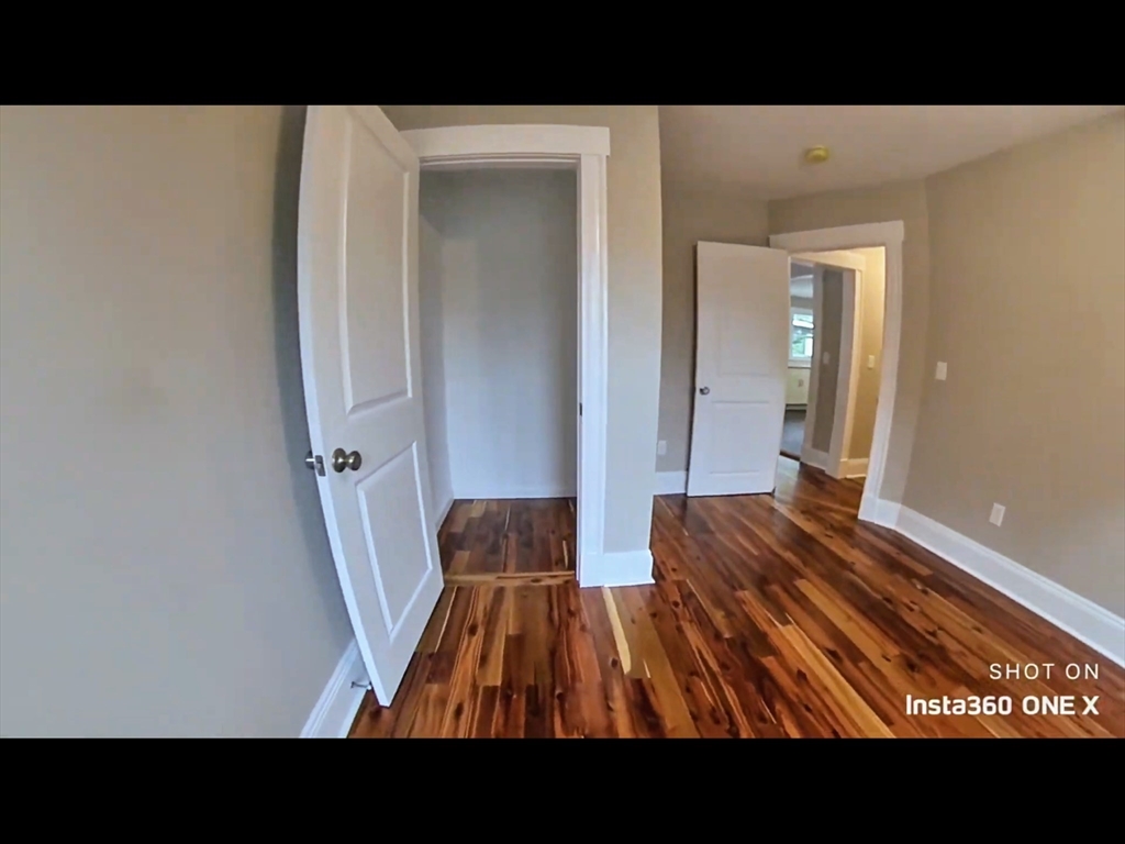 101-103 Lexington Street Newton, MA 02466 - Photo 7 of 37 a open area with wooden floor